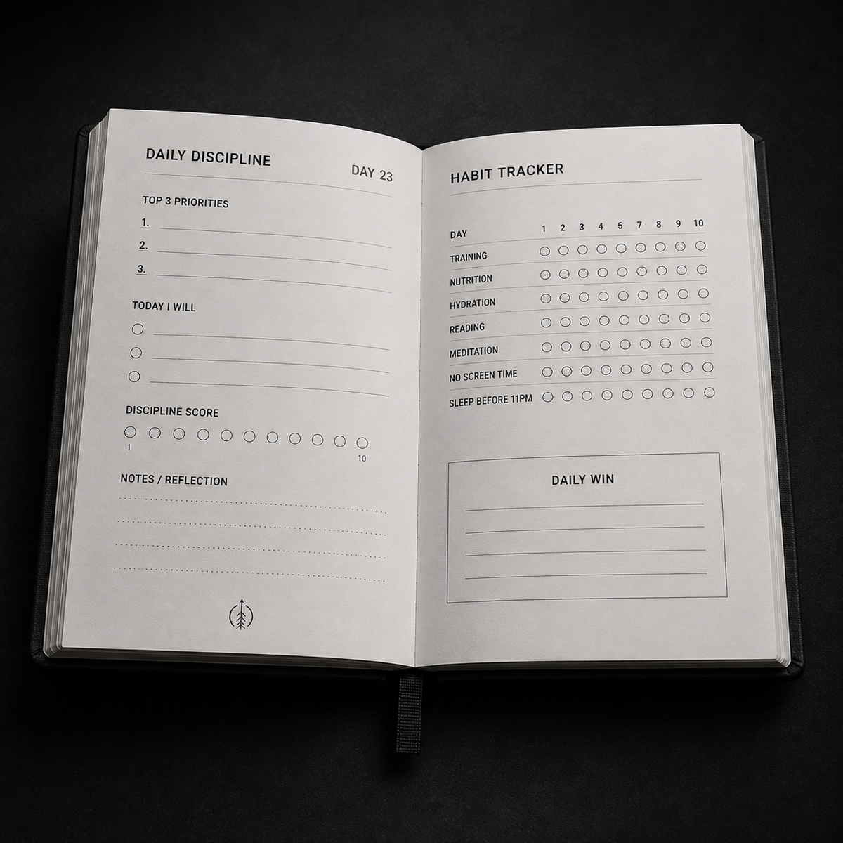 Open Foundations Journal spread showing Daily Discipline pages and the 10-day Habit Tracker